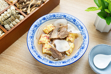 Chinese traditional soup - sea coconut flakes, corn and pork bone soup