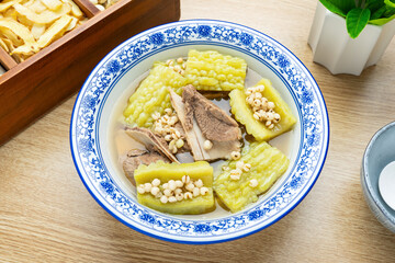 Chinese traditional soup - barley, bitter melon and pork bone soup
