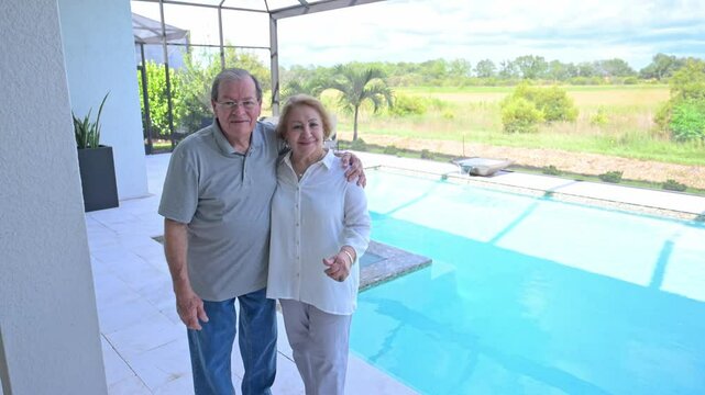 happy customers are pleased with the installation of their new pool and column free cage area in their new home