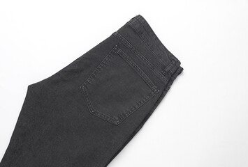 Dark gray men's jeans pants on a white background
