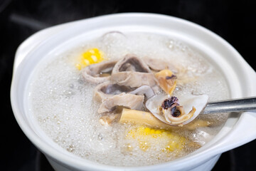 The old-fashioned soup boiling in the clay pot