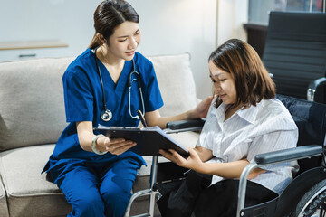 Obraz premium Friendly nurse doctor offering patient support during recovery. A loving caregiver taking care of her patient and showing kindness while doing a checkup in living home.