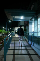 man walking at the train station