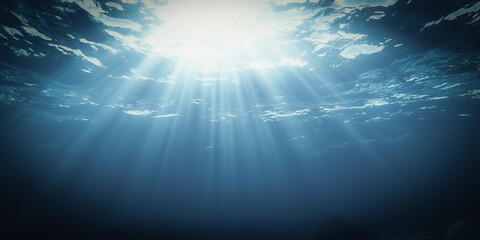 Obraz premium Sun rays penetrate the deep blue ocean, illuminating the underwater world with a tranquil and ethereal light, highlighting the beauty of the tropical sea.