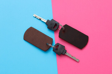 Leather keychains with keys on a pink blue background