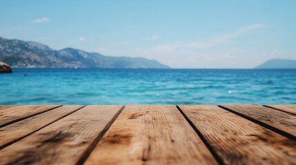 Obraz premium Closeup shot of a wooden table with sea in the background.