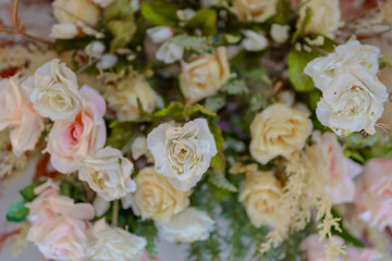 Flower arrangements for wedding decorations. Artificial flower arrangements with a rustic theme and pastel colors