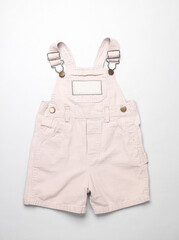 Children's overalls on gray background