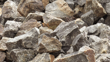 Large pieces of rock for construction are piled up