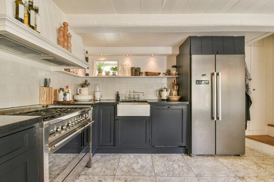 Modern kitchen interior with natural light and stainless appliances