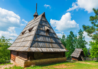 Old wooden houses in Serbian village. Rural landscape in summer