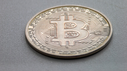 A silver coin with the letter B on it