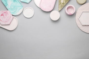 Plaster geometric shapes, trays on a gray background