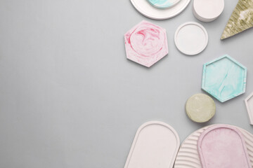 Plaster geometric shapes, trays on a gray background