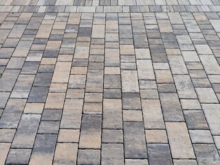 A detailed view of a patterned cobblestone surface designed with ample copy space