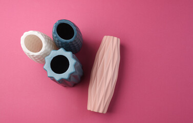 Minimalistic vases in Scandinavian style on pink background. Top view