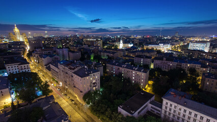 Fototapeta premium Panoramic view of the building from the roof of center Moscow night timelapse, Russia