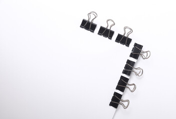 White blank sheet of paper with Black binders