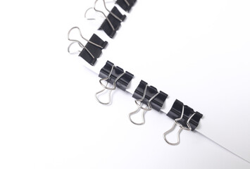 White blank sheet of paper with Black binders