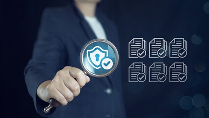 Businessman with business performance document checklist and approves business project.evaluation, project approval and enhancing business performance.