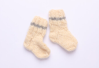 Children's woolen knitted socks on a white background