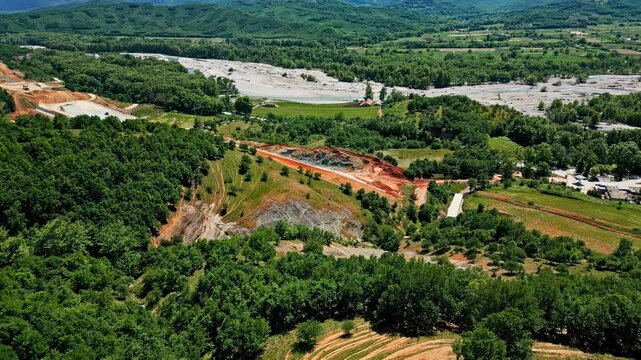 Green landscape and quarry with orange tone, aerial view