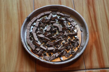 The residue from burning spiral mosquito coils takes the form of ash in its place. With a close look.