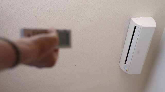 Hand operating air conditioner remote control