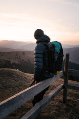 Hiker Resting with Scenic Mountain View at Sunset