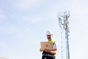 communication pole. Communications engineer checking internet signal on laptop computer at transmitter station. Product quality Inspection