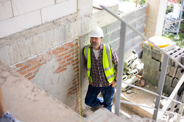 engineer building inspection working at construction site. Architect and contractor working on building in construction site. Professional Architects Engineer