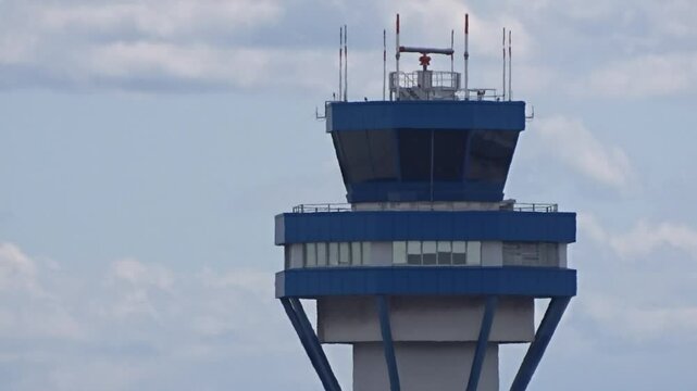close-up view airport control tower, highlighted by soft backlight, intricate air traffic control airport landmark tower close-up air navigation backlit close up architecture