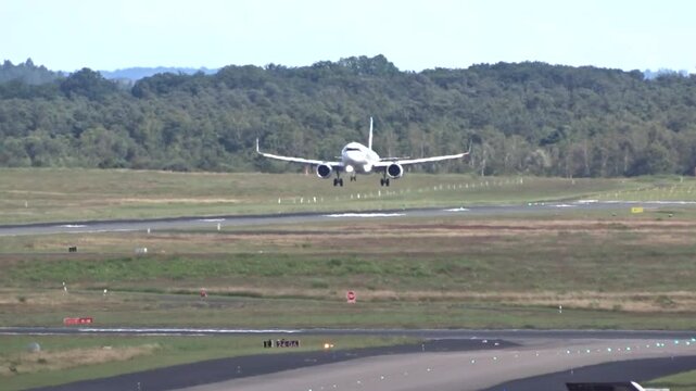 generic passenger jet landing airport focuses smooth touchdown aircraft&rsquo;s deceleration runway aviation airplane airport operations aviation video aircraft landing airport footage