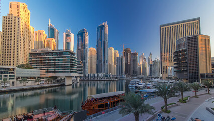 Obraz premium Morning view of Dubai Marina towers and canal in Dubai timelapse