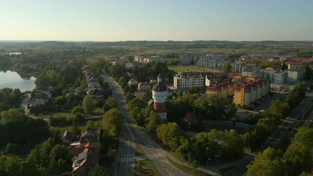 Panoramic view of Elk Water Tower and Elk Lake at the intersection of 11 Listopada and Kajki Streets, Aerial pullback shot