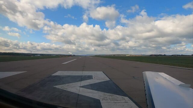 aircraft backtracking on the runway ready for departure and take off wing view window airport aviation
