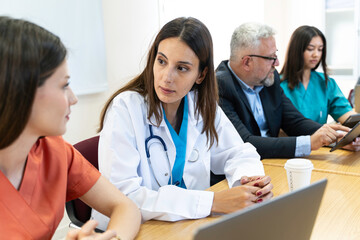 Group of Medical Team and Business People Meeting in Hospital and Office Conference Room