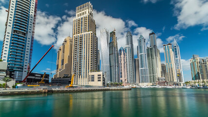 Naklejka premium Dubai Marina towers and canal in Dubai timelapse hyperlapse