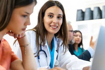 Group of Medical Team and Business People Meeting in Hospital and Office Conference Room