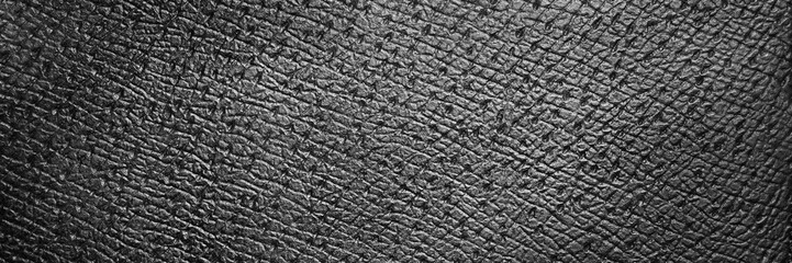 Naklejka premium Beautiful texture of a fine black leather surface using as background or header. Web banner
