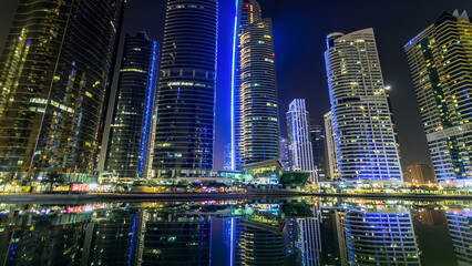 Obraz premium Residential buildings in Jumeirah Lake Towers timelapse hyperlapse in Dubai, UAE.
