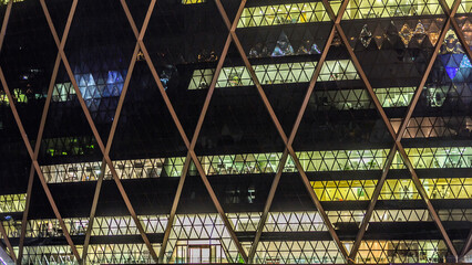 Window of the multi-storey building of glass and steel lighting timelapse