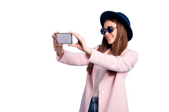 Profile side photo of cheerful girl using her cell phone making self portrait enjoying promenade wearing pink outfit isolated over blue background - Powered by Adobe
