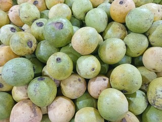 Indonesian countryside guavas very delicious. A close up of a pile of fresh, guavas in the market.