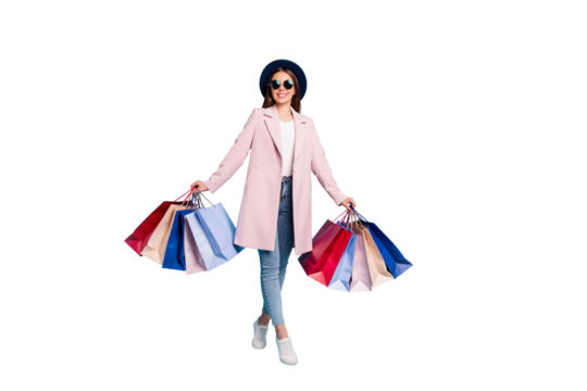 Full size photo of lovely funny girl on her weekends go shopping buy presents souvenirs wear vintage season coat denim jeans eyeglasses eyewear isolated over blue background