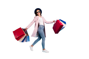 Full length photo of cheerful funky lady tourist in eyewear eyeglasses go shopping buy sales...