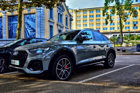 Saint-Etienne, France - September 1st 2024 : Silver Audi Q5 55 TFSI e parked in the street. It's an hybrid car.