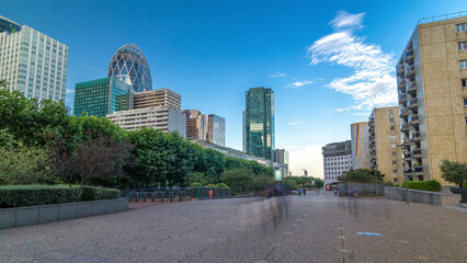 Fototapeta premium Skyscrapers of La Defense timelapse hyperlapse - Modern business and residential area in Paris, France.