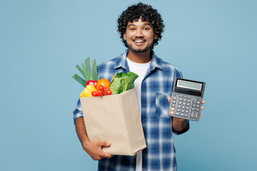 Young smiling happy Indian man he wear shirt hold brown craft bag for takeaway mock up with food...