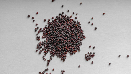 Mustard seeds on a white background